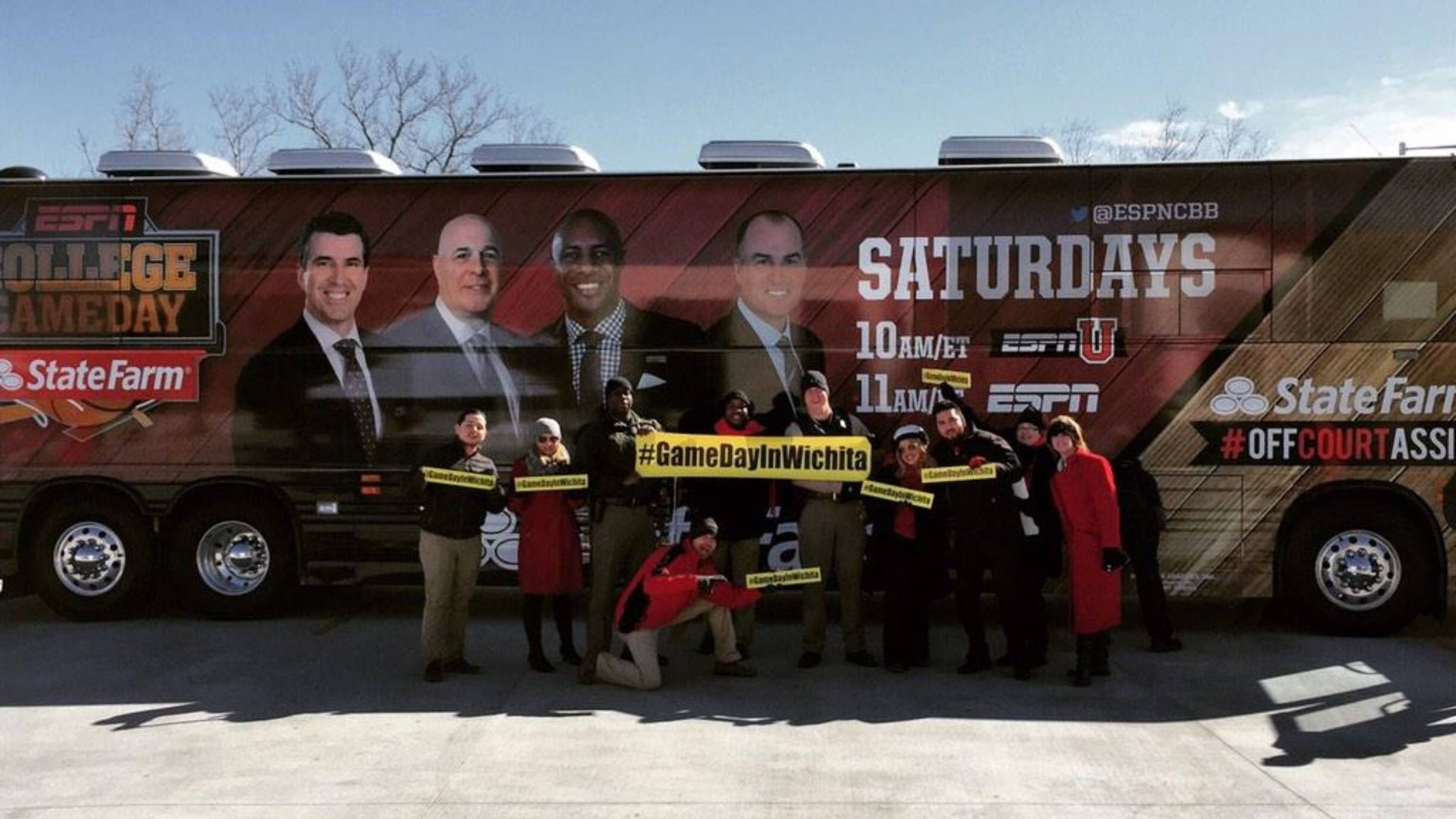 A group of students gathered in front of the ESPN College Gameday truck. 