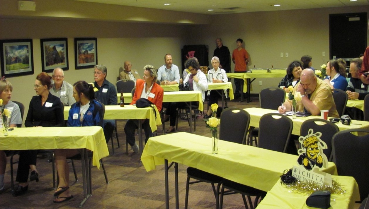 Participants of the Fall 2012 Growing Rural Businesses Training in Greensburg seated and chatting.