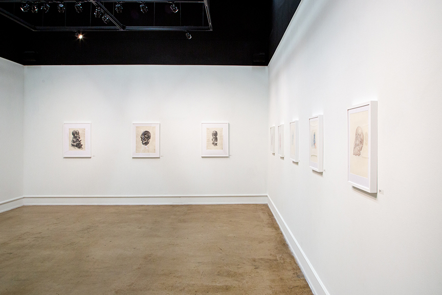 image of gallery with drawings hanging on walls