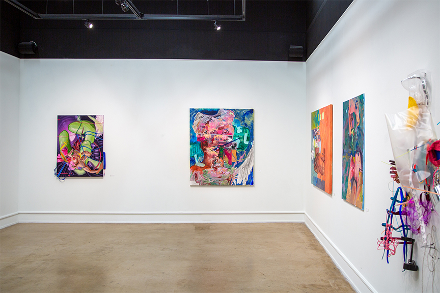 view of Clayton Staples gallery with paintings and sculptural work hanging on walls.