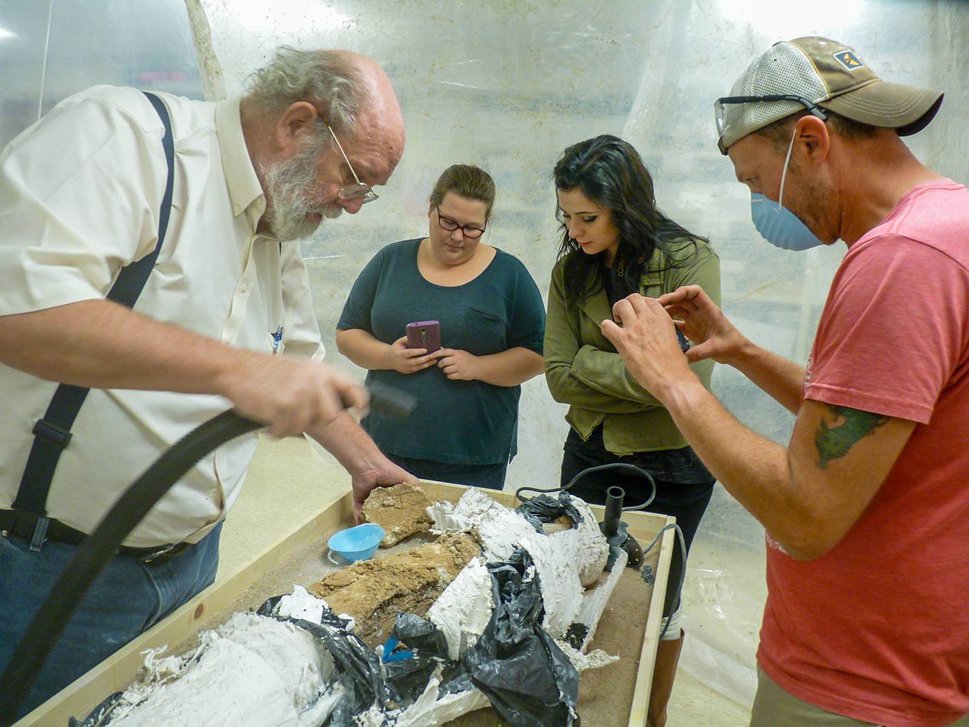 WSU students and professor work to excavate a mammoth tusk discovered in Cunningham, Kansas