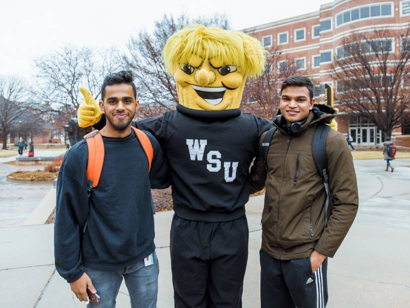 Wu posing with students