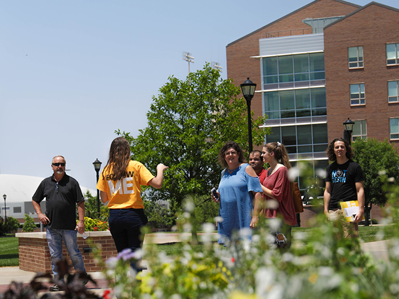 Students and families walking on campus