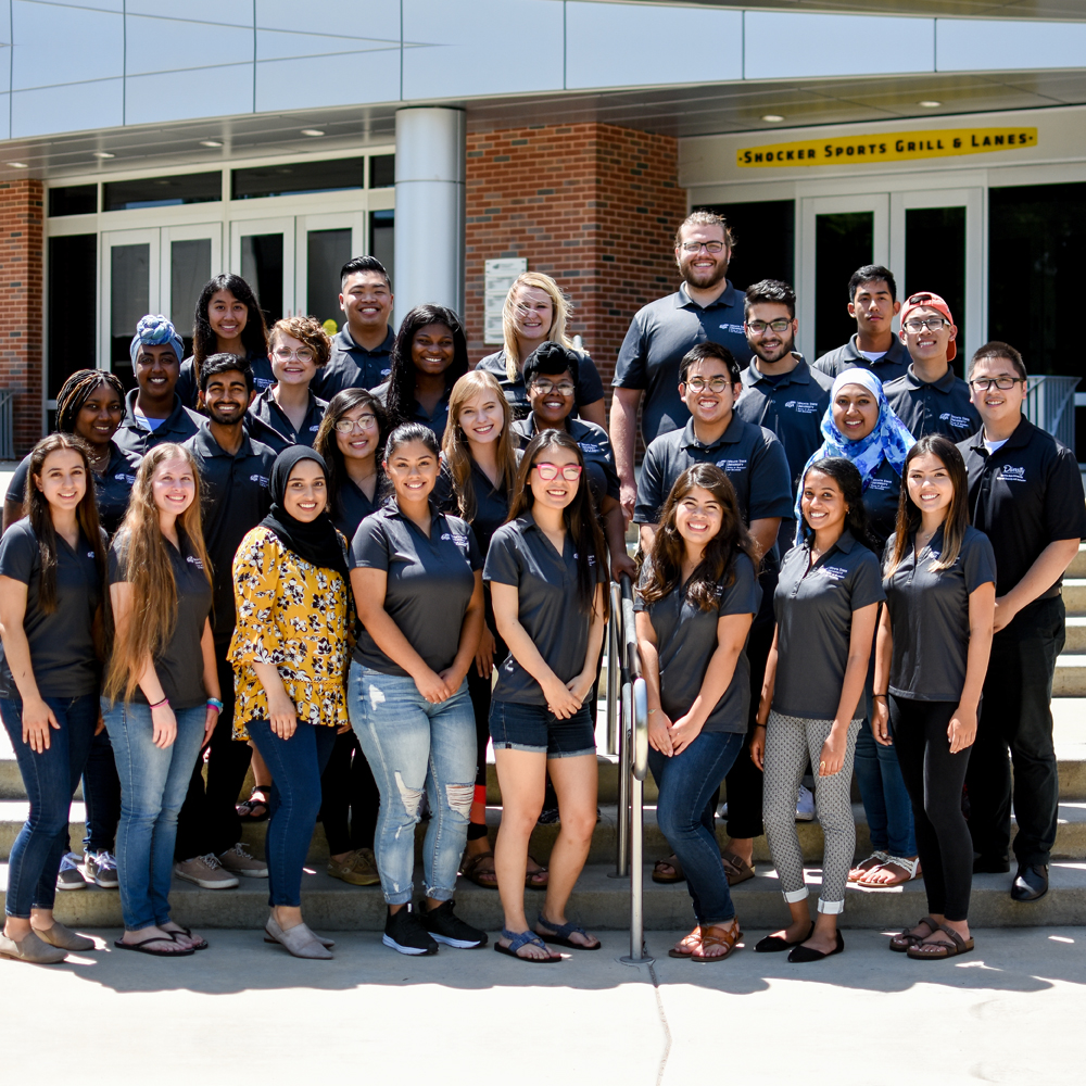 A group of student ambassadors taking a picture together in front of the RSC.