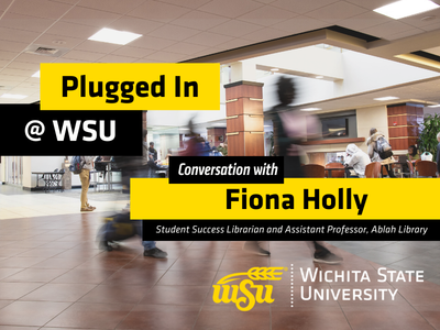 A Conversation with Fiona Holly Students walking in a student center