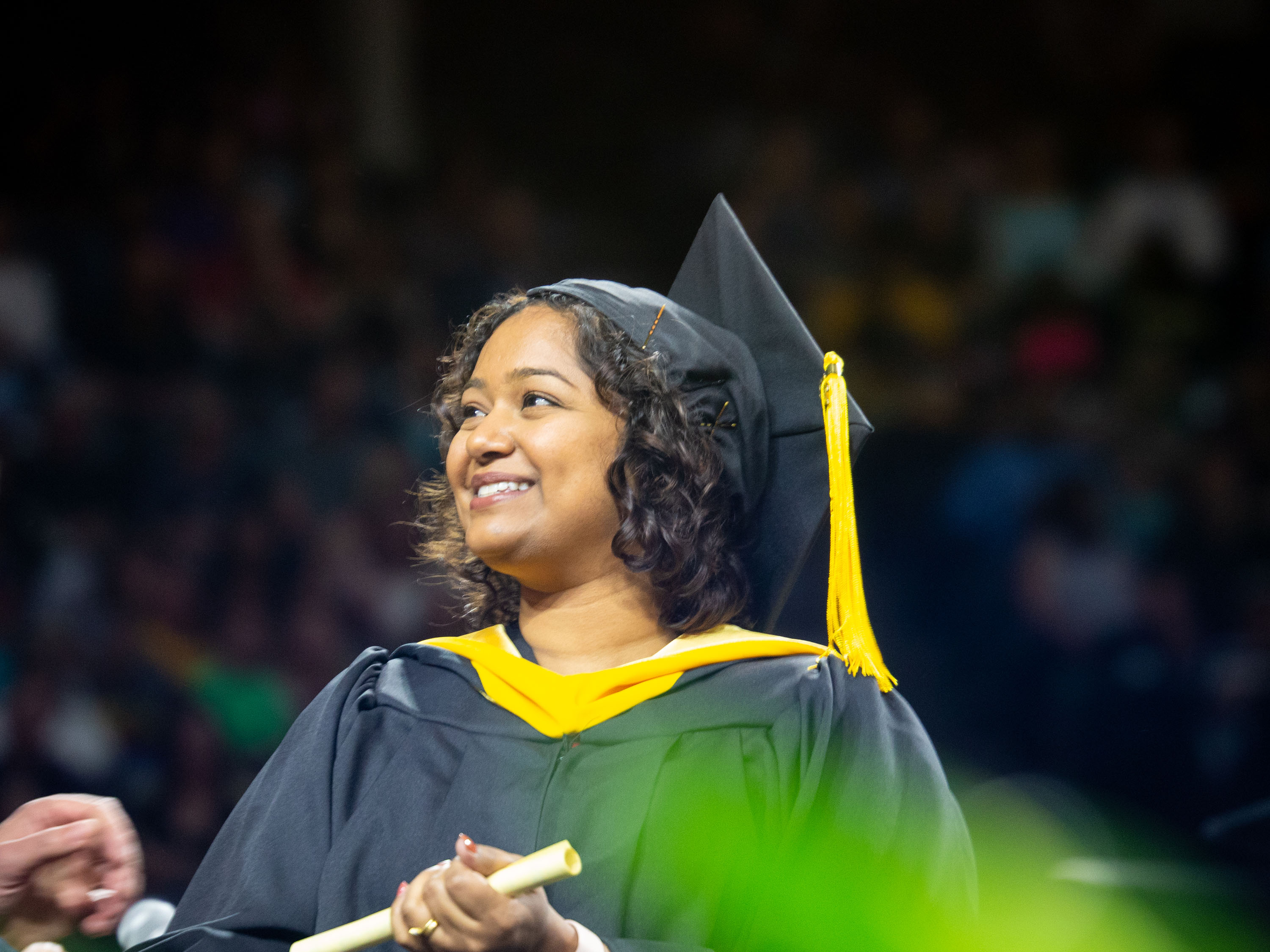 Student receiving her diploma at 2019 spring commencement