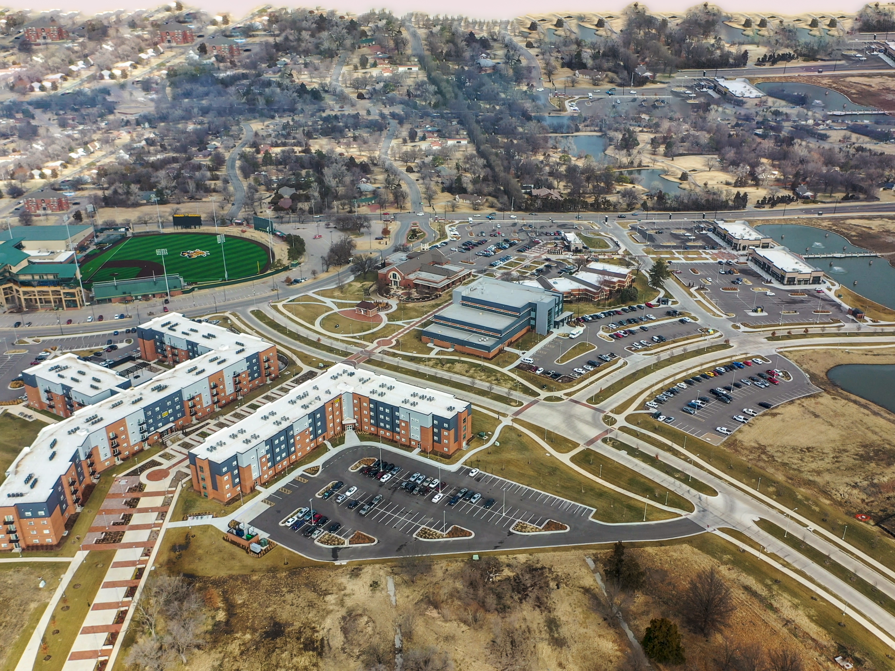 Aerial view of the Innovation Campus, including The Flats and Suites, Law Enforcement Training Center and Braeburn Square