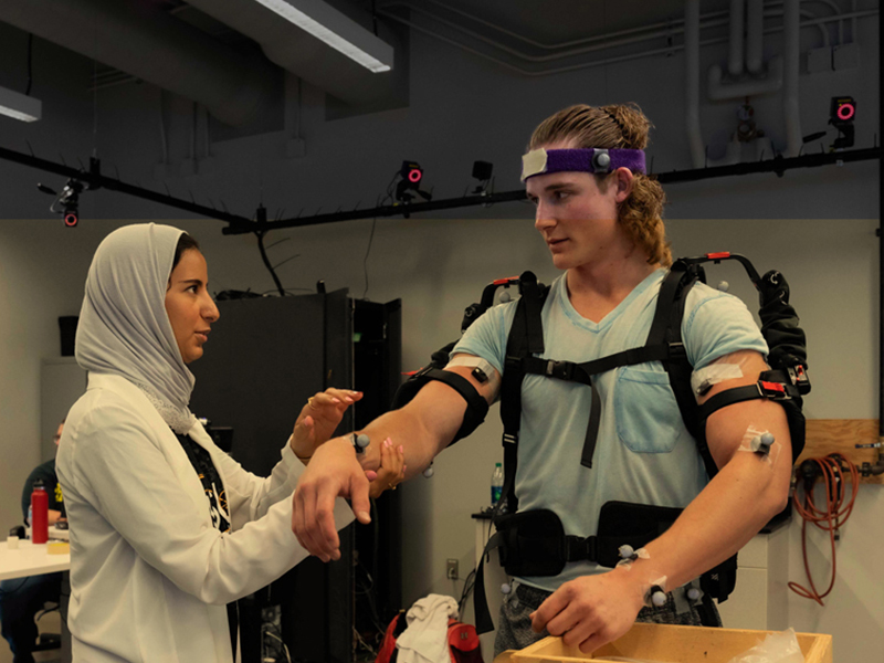 Two students participate in a lab exercise