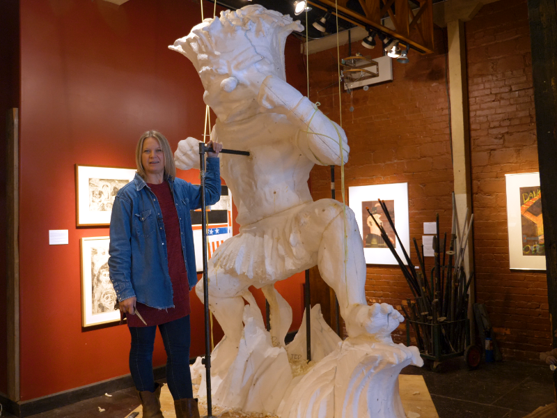 Artist Connie Ernat with a lifesize replica of the WuShock sculpture
