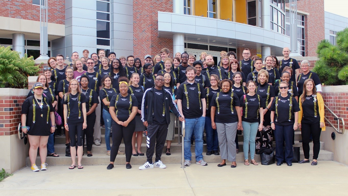 First-gen graph Image of members of CAPS posing outside at WSU campus.