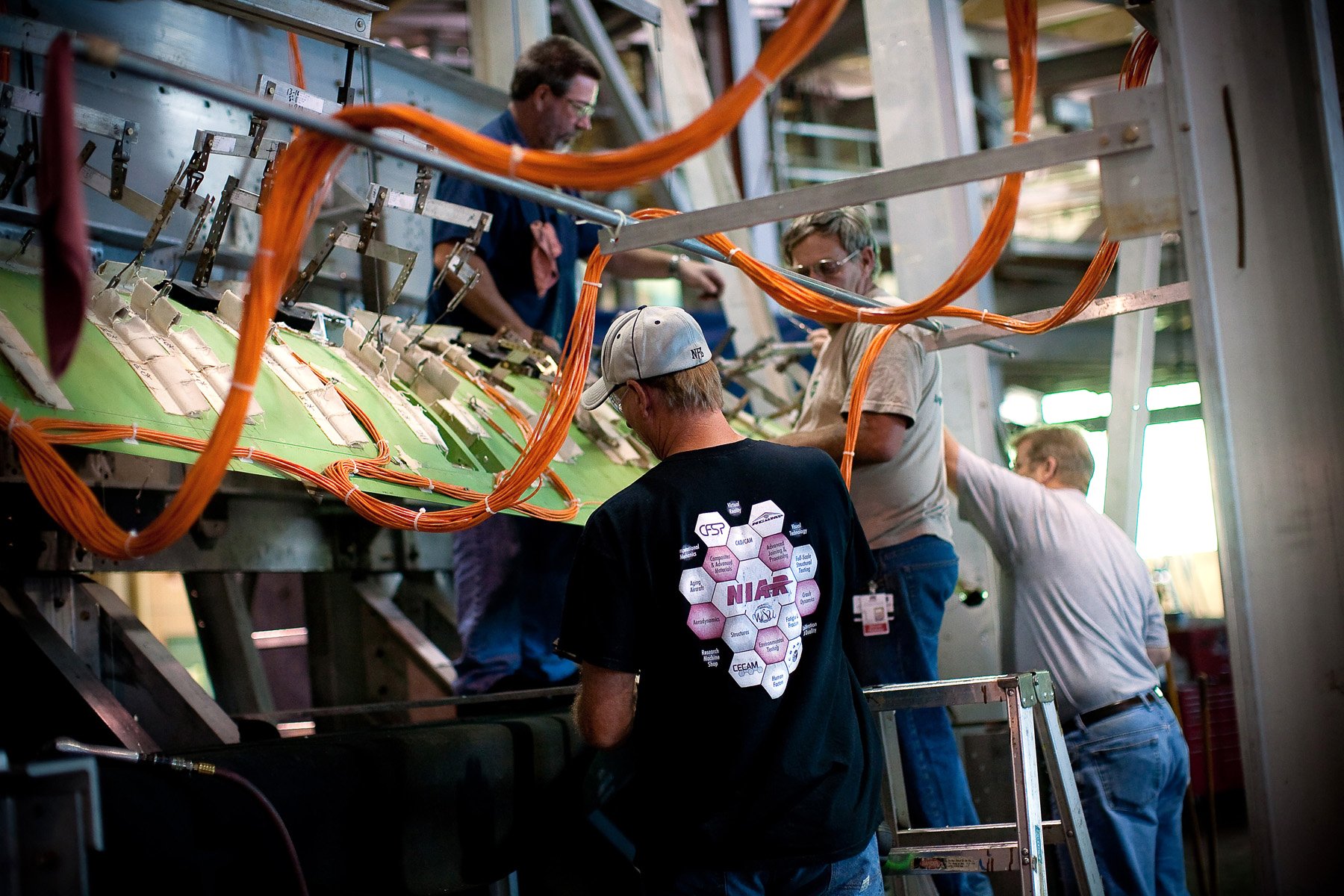 NIAR Research technicians for a wing for fatigue testing in the Full-Scale Structural Test Lab at NIAR's ASTEC facility.