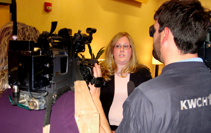 Angela Buzard, public affairs associate for the WSU's Hugo Wall School of Urban and Public Affairs, speaks with the media at the press conference announcing the establishment of the Environmental Finance Center.