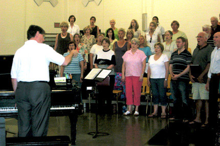 Tom Wine, director of choral activities at Wichita State University, leads a rehearsal of the WSU Summer Choir.