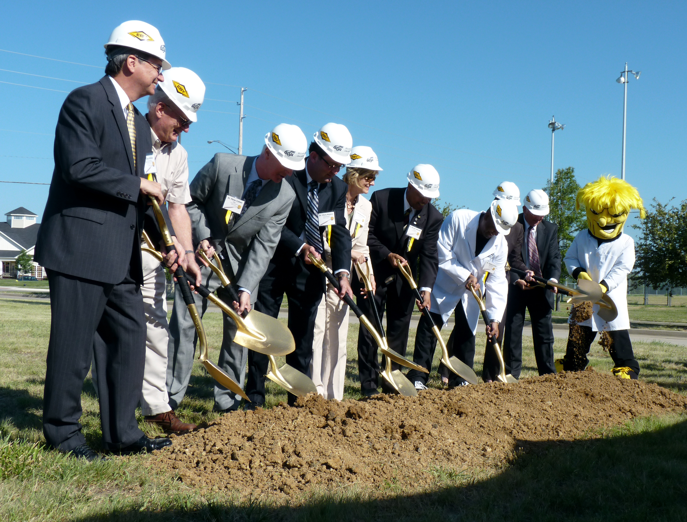 Wichita State University and community dignitaries break ground for the university's new Advanced Education in General Dentistry facility in a ceremony held July 22.