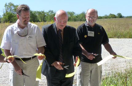 From left: WSU alumnus Curt Gridley, WSU President Donald Beggs and Bill Bischoff, dean of the Fairmount College of Liberal Arts and Sciences, cut the ribbon for the new research and classroom center at the Biological Field Station: Ninnescah Reserve