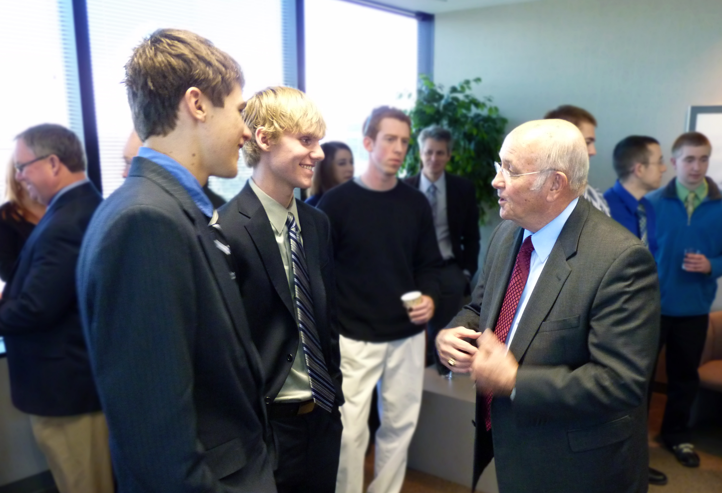 Jabara Scholarship winners Joseph McNorton, left, and Brittan Smith, center, talk with WSU President Don Beggs at Wednesday's press conference.