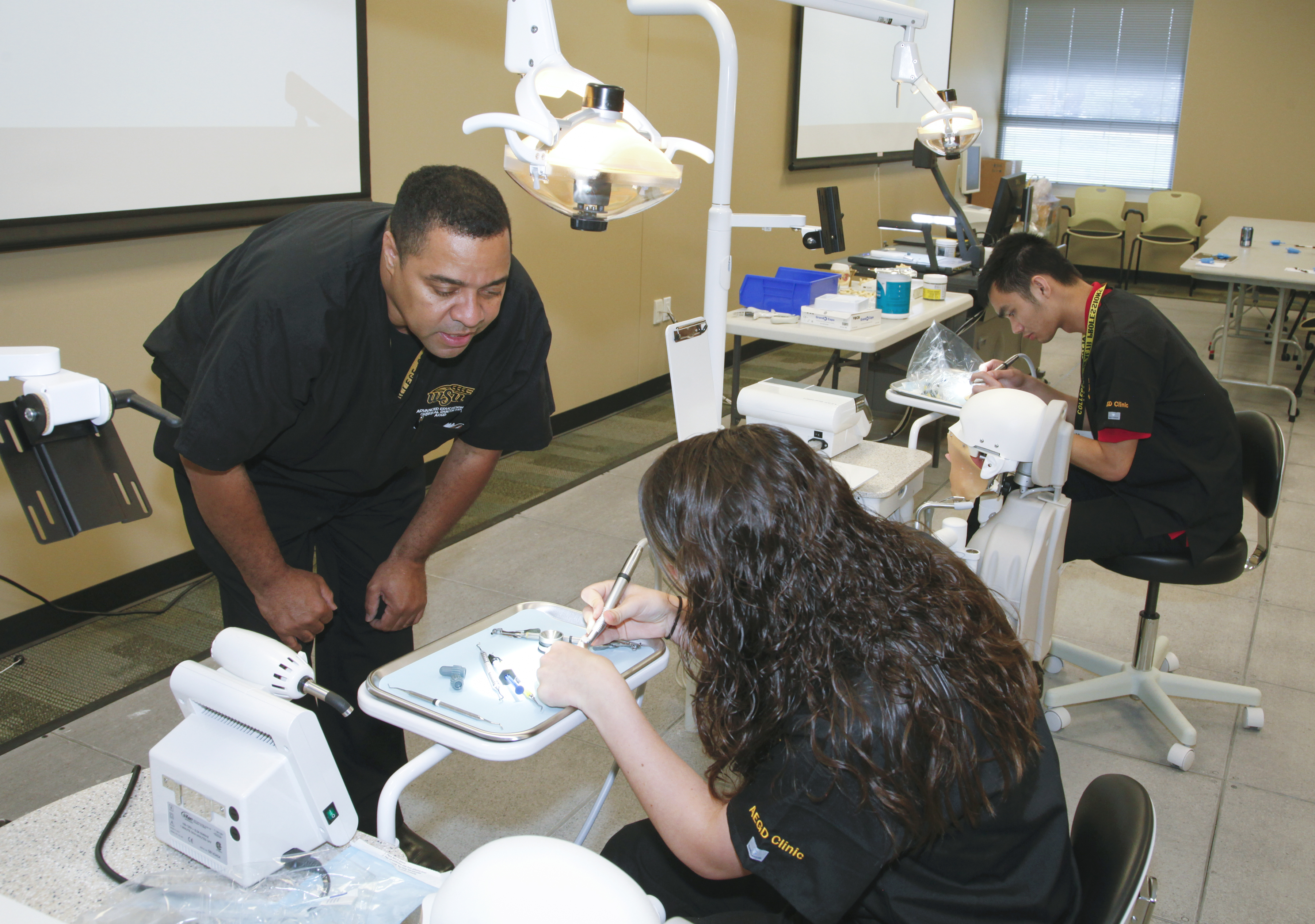 AEGD program director, Dexter Woods, left.