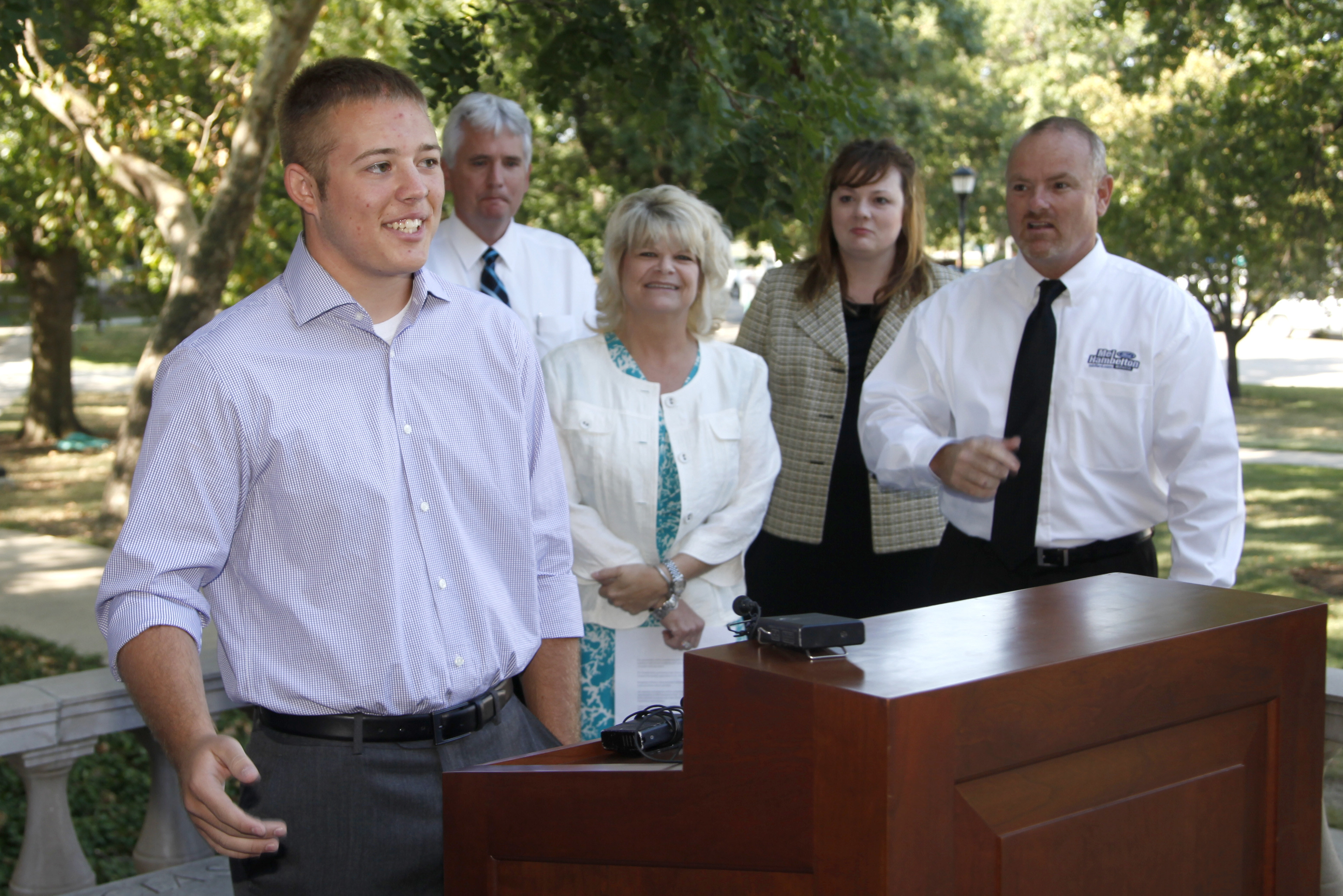 Thomas Dieker with officials from Mel Hambelton in the background.