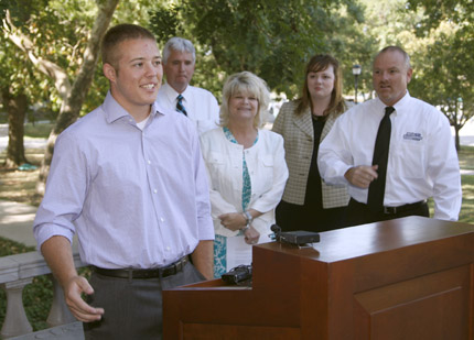 Thomas Dieker, a graduate of Trinity High School in Wichita, accepts the first Mel Hambelton Endowed Scholarship at Wichita State.