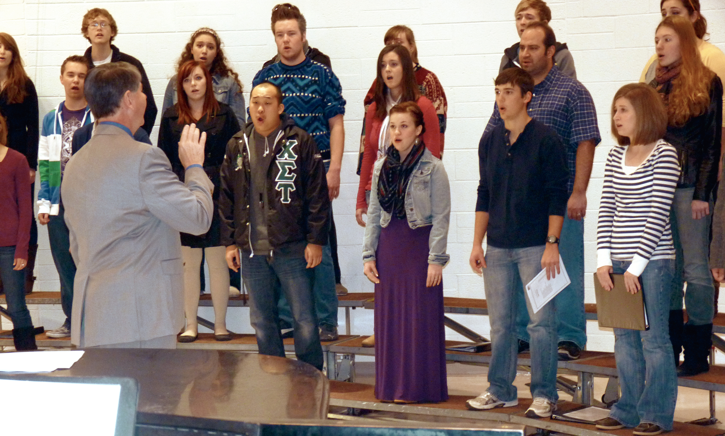 Tom Wine directs Wichita State Madrigals during rehearsal for the annual Candlelight Concert, set for Dec. 2 and 3.