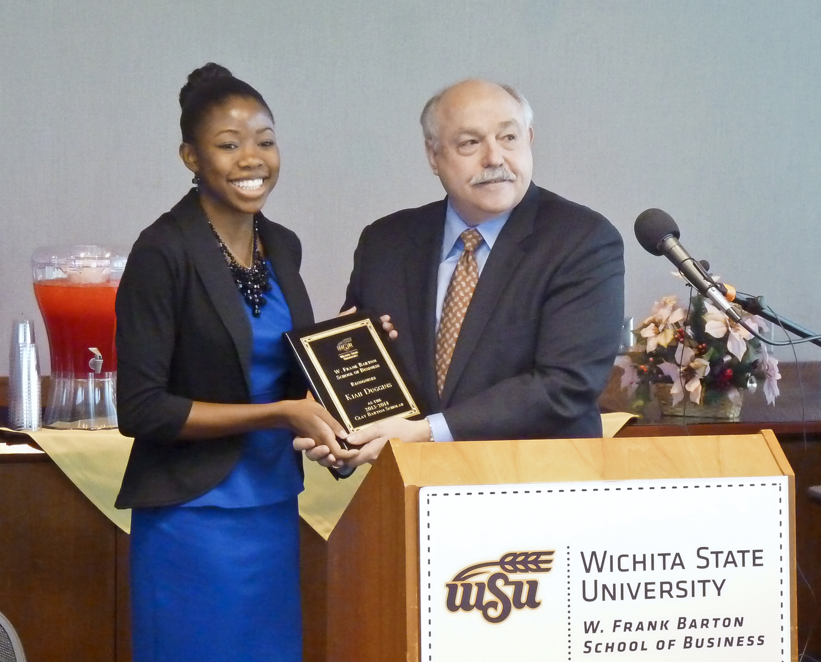 Kiah Danielle Duggins and Doug Hensler, dean of the W. Frank Barton School of Business at Wichita State.