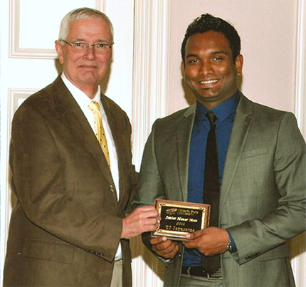 TJ Jayaratne with WSU President John Bardo at the 2013 Senior Honor banquet.