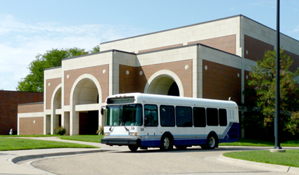 One of WSU's new campus shuttles makes a stop at Wiedemann Hall on its first day of service. The buses will eventually be branded with a WSU color scheme.