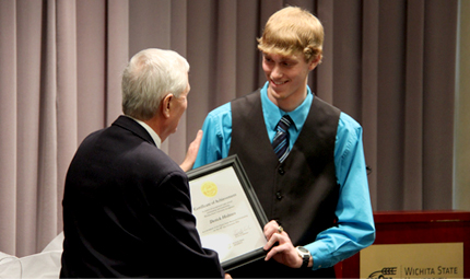 Derick Holmes, pictured with WSU President John Bardo, is one of two Kansas high school seniors to win the $52,000 Gore Scholarship.