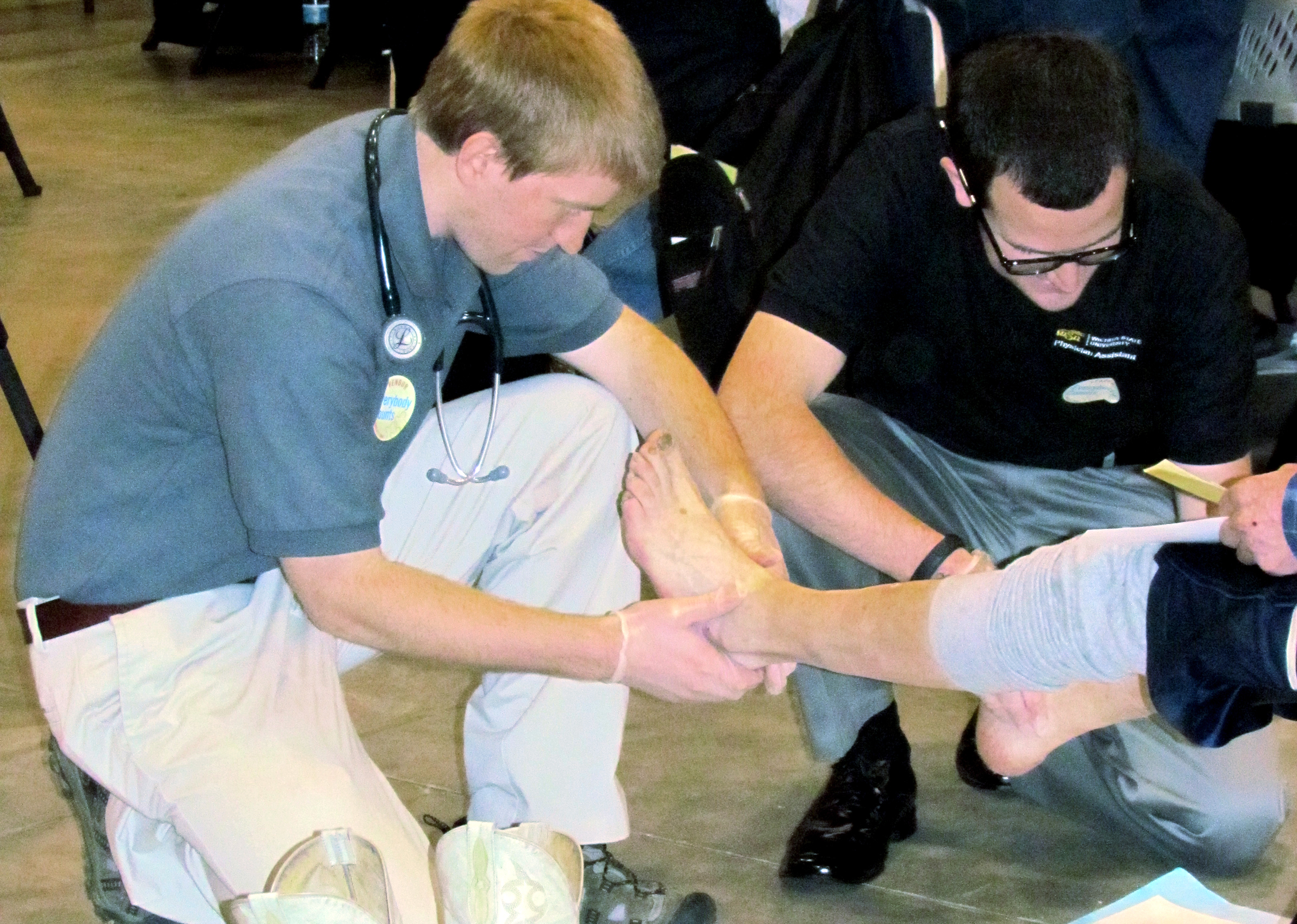 Physician assistant students Justin Schulte, left, and Mason Ray provided medical services for the homeless at the United Way Point in Time Homeless Count.