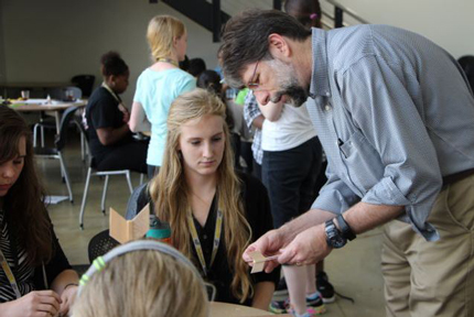 L. Scott Miller explains how tail fins stabilize an arrow in flight on the first day of the High School Aerospace Camp, hosted by WSU's College of Engineering.