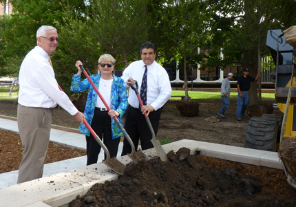 WSU President John Bardo, Vice President for Administration and Finance Mary Herrin and Provost and Senior Vice President Tony Vizzini help plant a Lace Bark Elm on the Yale Walk just east of Shocker Hall Tuesday, Sept. 2.