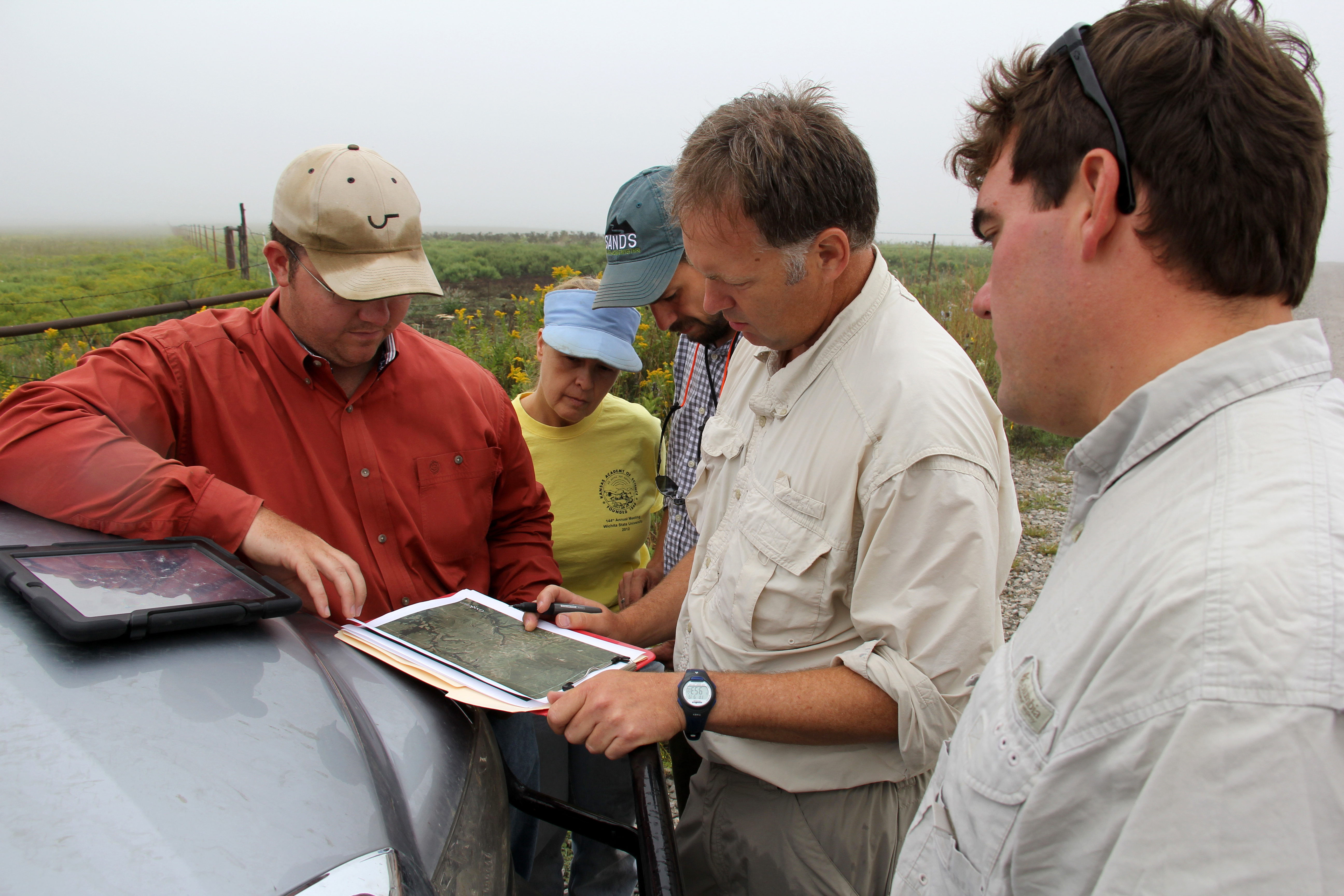 WSU researchers look over a map of the Youngmeyer Ranch acreage