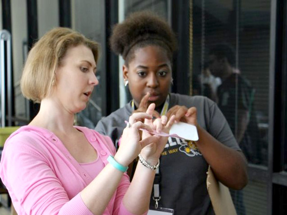 Laura Bernstorf of Airbus, a WSU engineering alumna, explains aerodynamic design concepts to a participant in the High School Aerospace Engineering Camp held in July by WSU College of Engineering. The purpose of STEMpact2020 is to promote more of these kinds of interactions.