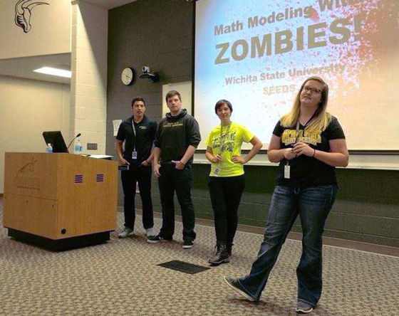 Four WSU engineering students challenge students at Maize South High School to use math to figure out how to survive a zombie attack.