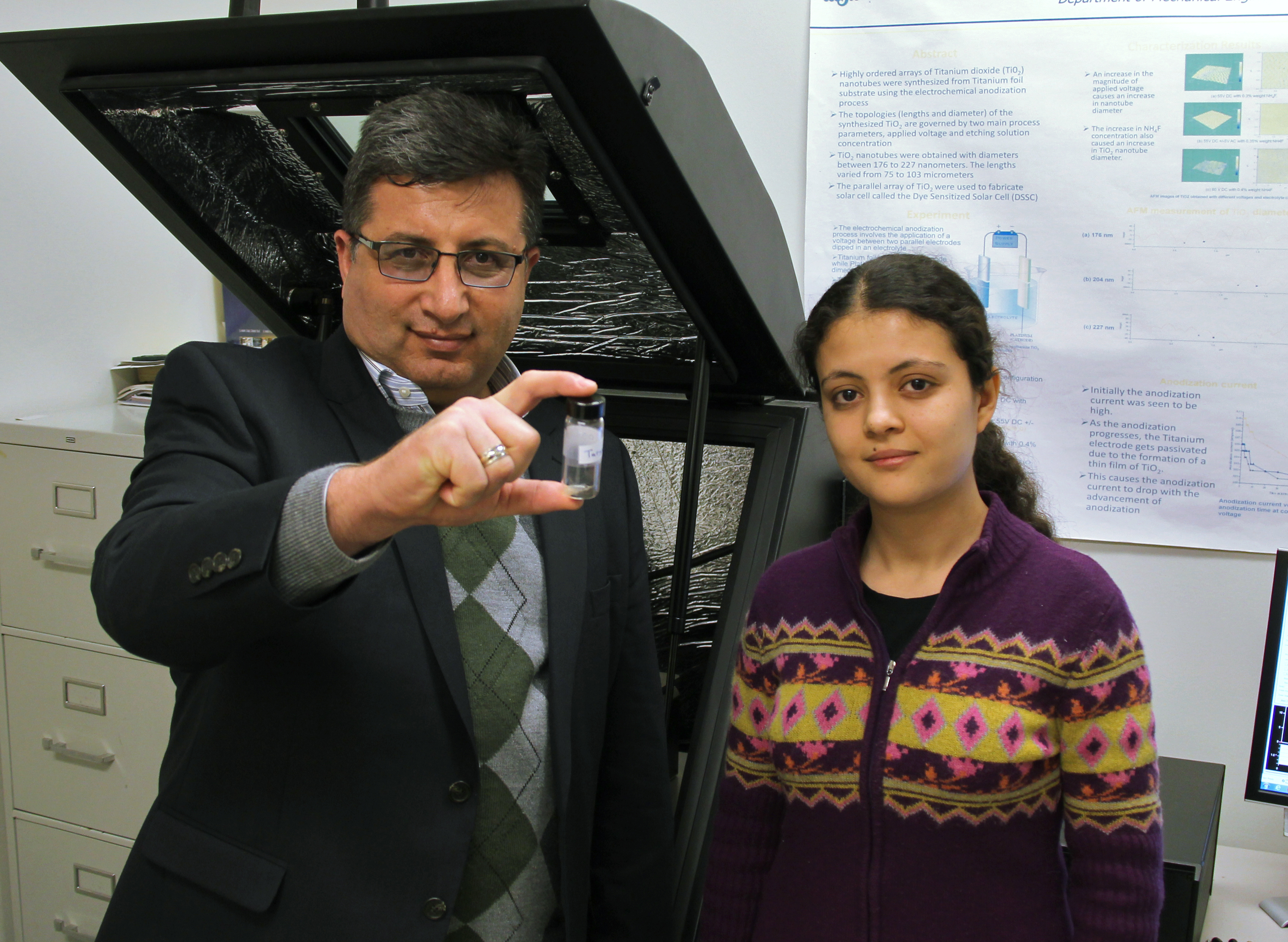 WSU professor Ramazan Asmatulu, left, with grad student Aybala Usta. Along with two other professors, the pair are working on cancer research involving the use of nanoparticles to deliver drugs to tumor sites.