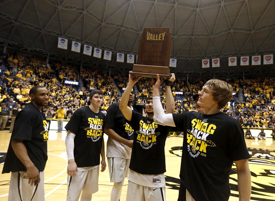 Shocker men's basketball starters hoist the Missouri Valley Conference championship trophy following WSU's 74-60 victory of Northern Iowa. From left: Tekele Cotton, Evan Wessel, Darius Carter, Fred VanVleet and Ron Baker.