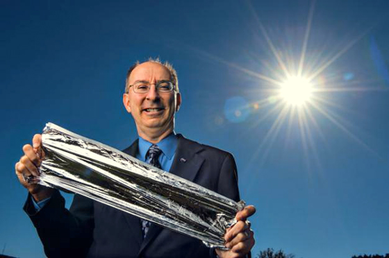 Les Johnson, holding a piece of solar sail material. He's the technical advisor for NASA's Advanced Concepts Office at the Marshall Space Flight Center and an author of books about science fiction and science fact.