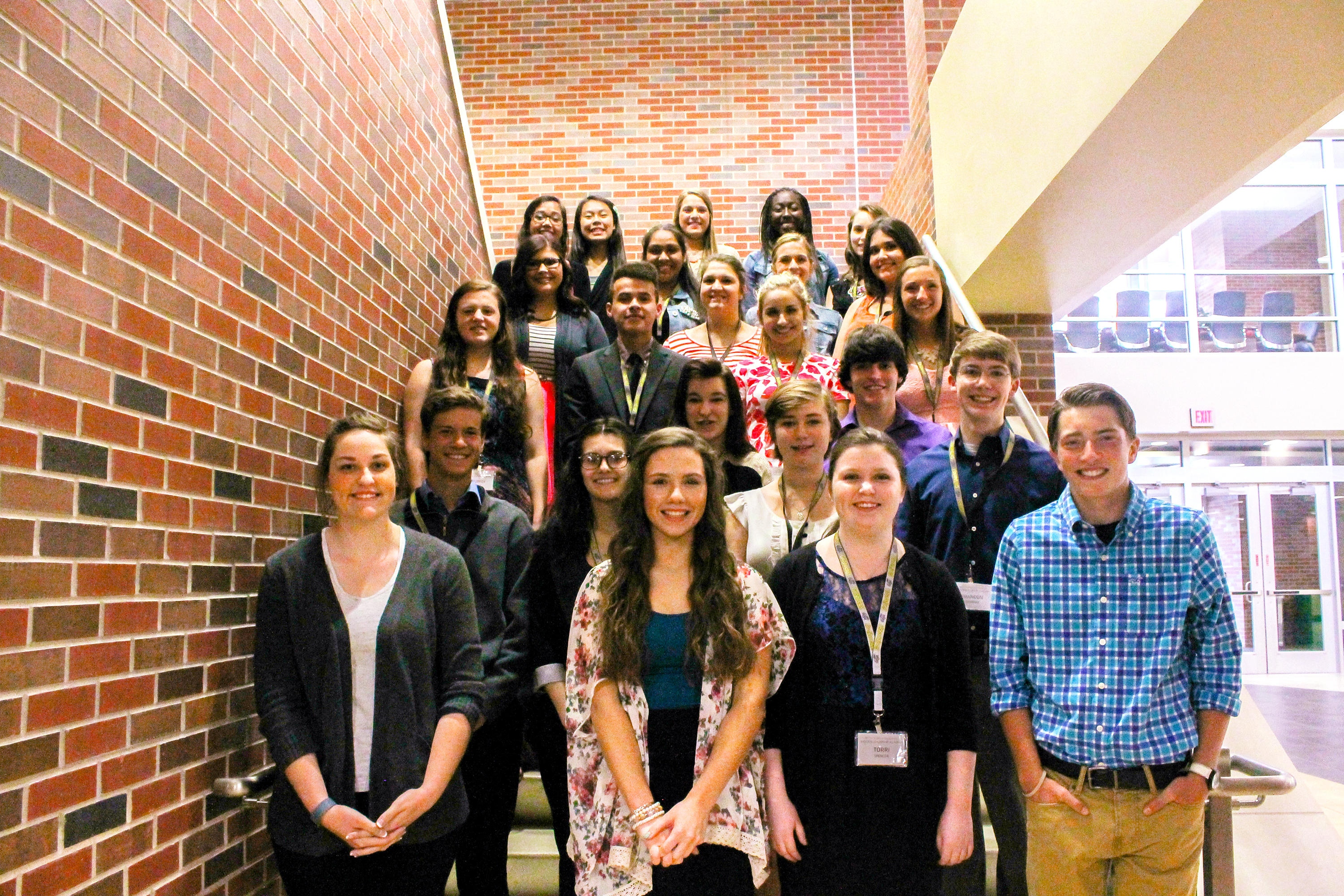 Graduates of the Shocker Leadership Academy program pose for a group photos.  The program aids students in building their leadership skills by learning from community leaders, as well as each other.