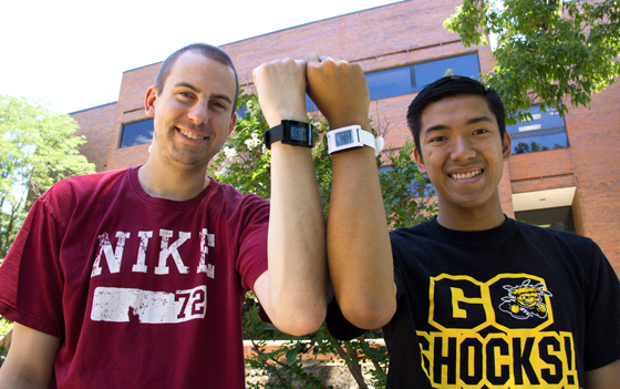 Wichita State University students Brandon Bartlett, left, and Linh Vu have invented smartwatch software that allows physicians to remotely communicate with their patients.