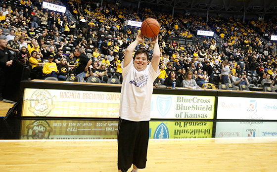 Tanner Wilson, a member of the Air Capital Flyers since he was 8 years old, shoots the ball during the Halftime Shootout at Charles Koch Arena.