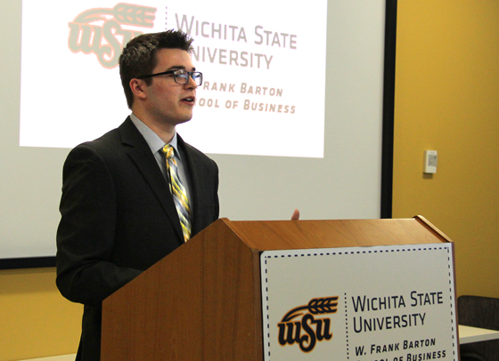 High school senior Caelan Dean accepts this year's Barton Scholarship, one of the many competition-based scholarships available at Wichita State.