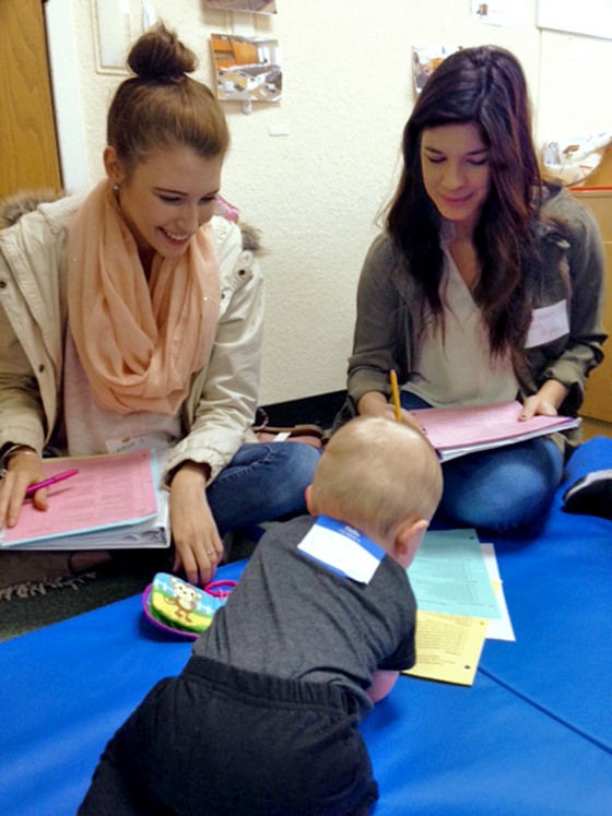 CSD and PT students observe a baby during the annual Baby Day event.