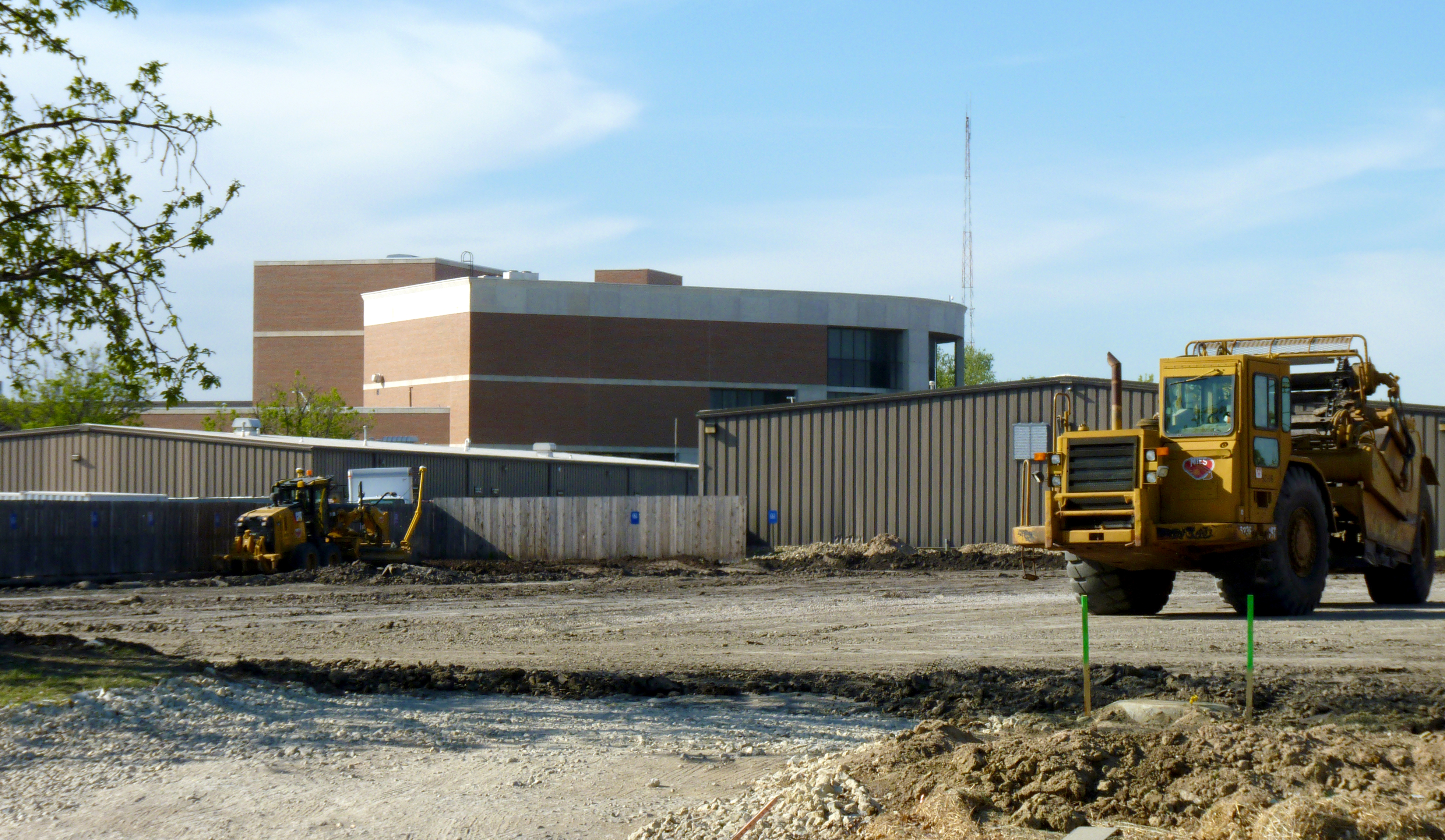 Construction crews level the ground for a new parking surface on the southeast corner of campus. The lot is expected to open in August, part of a major influx of new spaces by the end of the 2016 calendar year.