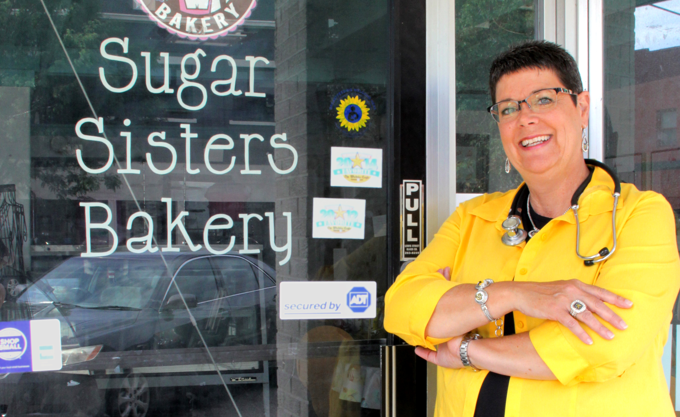 Jolynn Dowling at the door of Sugar Sisters Bakery. The bakery is one of the Wichita businesses that pledged to participate in the Breastfeeding Welcome Here program.