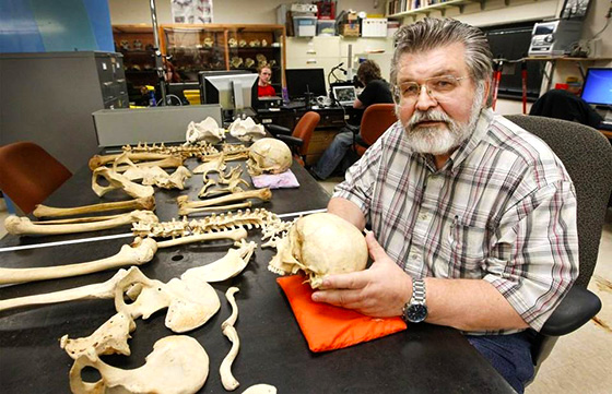 Peer Moore-Jansen, a Wichita State anthropology professor and CSI expert, displays some of the human skeletons he has in his lab at the school's anthropology department.