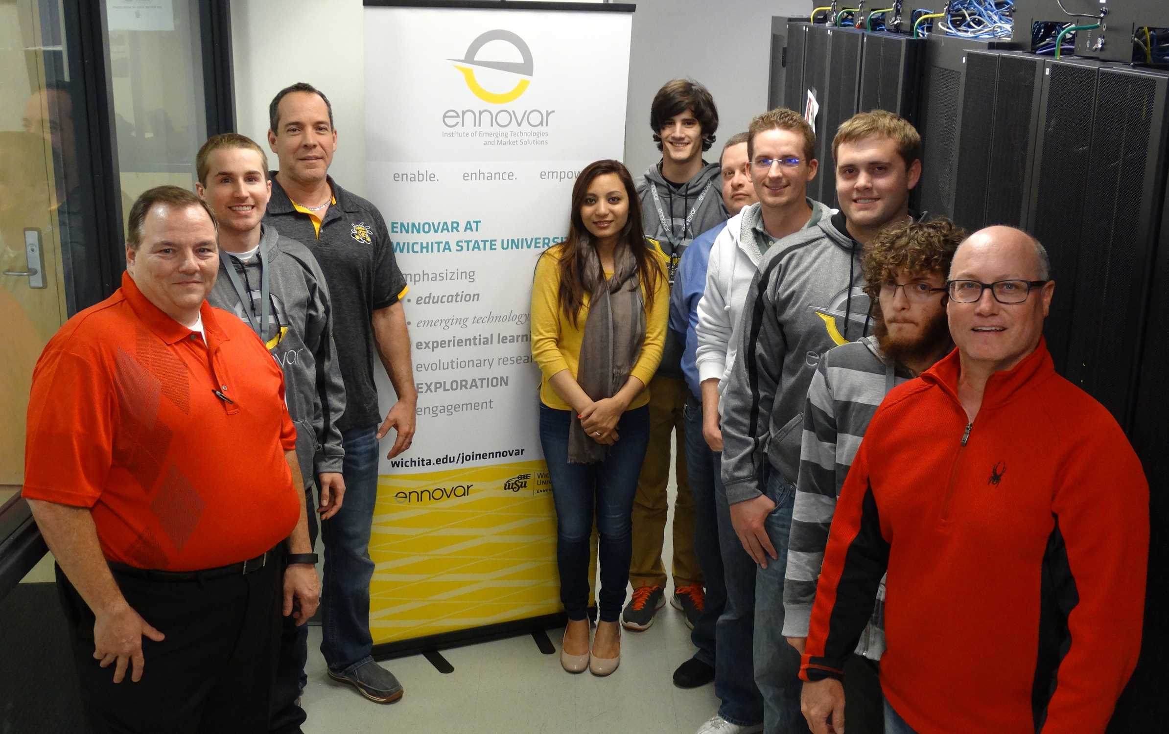 Ennovar staff and students pose with Commvault engineer Bill Roberts in the Ennovar server room at Wichita State., Ennovar staff and students pose with Commvault engineer Bill Roberts in the Ennovar server room at Wichita State.