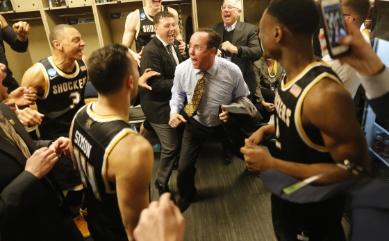 Wichita State University Head Coach Gregg Marshall celebrates with his team following the Shockers' 64-58 victory over Dayton in the NCAA Men's Basketball Tournament First Round.