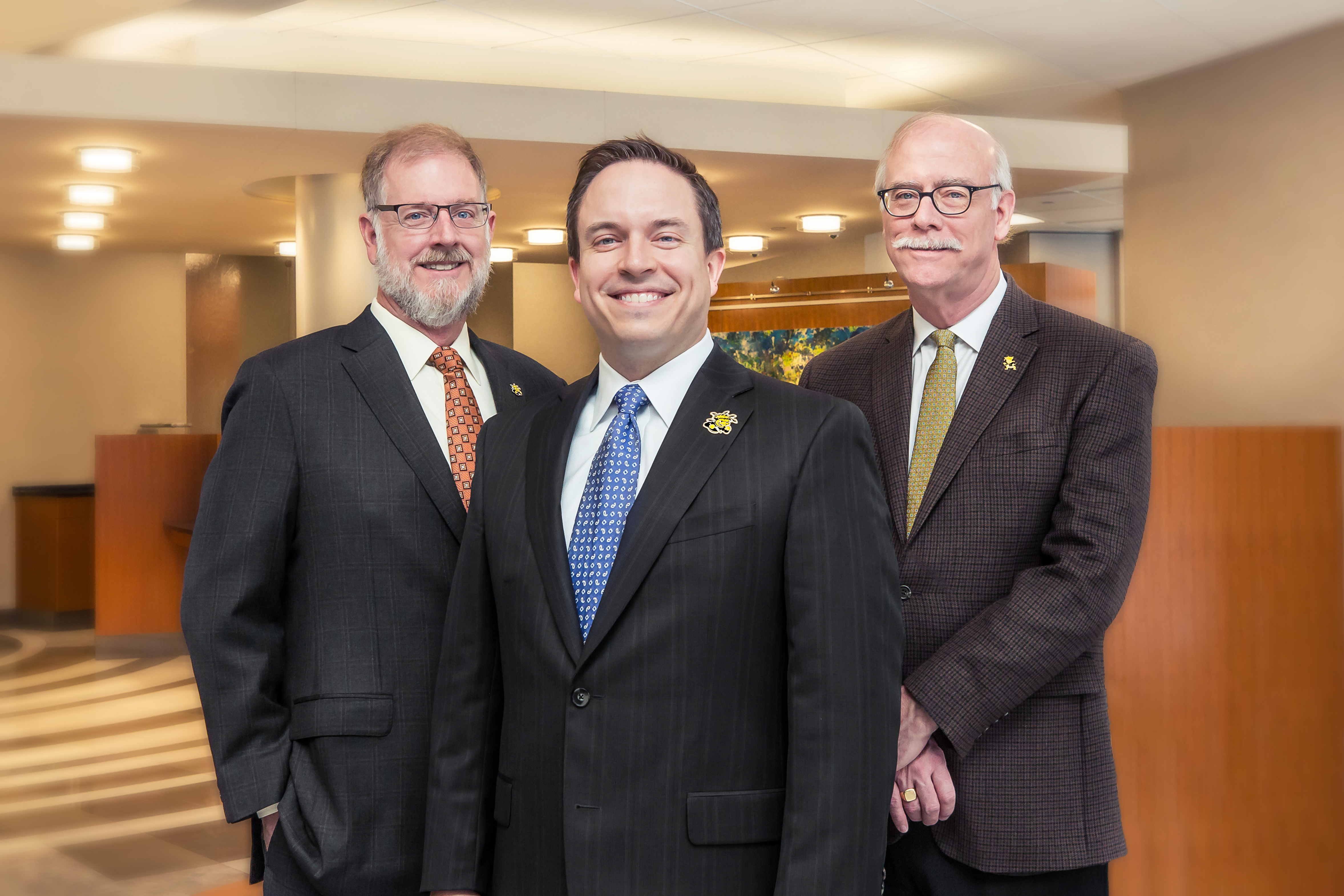 Members of the Bastian family and their family-owned Fidelity Bank have contributed $1 million to Wichita State University to help build a new home for the W. Frank Barton School of Business. From left are Clark Bastian, Aaron Bastian and Clay Bastian.