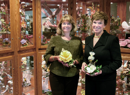 Carole Lindley, left, and Nancy Martin pose in front of the Boehm sculpture collection, part of which was donated to Wichita State.