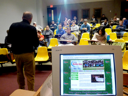 Director of the PHS Wichita Open, Roy Turner, speaks to the WSU sports marketing class about its collaboration to bring social media to the annual golf tournament.